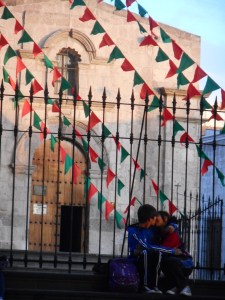 in love together as the sun goes down by the church