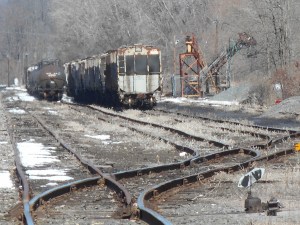 a string of covered hoppers in the winter sun
