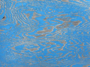 some old blue faded and worn with the grain