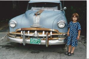 asked to pose with an old Pontiac her stoic look...