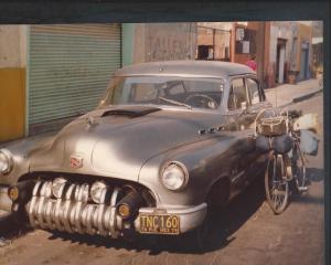 Puebla Mexico 1978 my bicycle leans against the old Buick