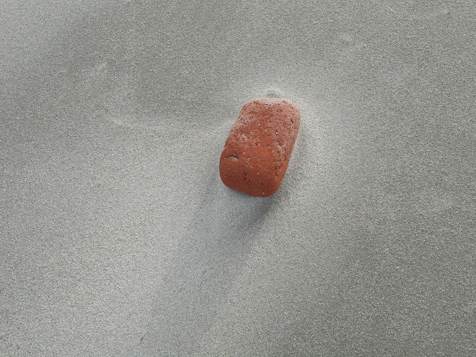 a-brick-getting-softened-by-the-sea