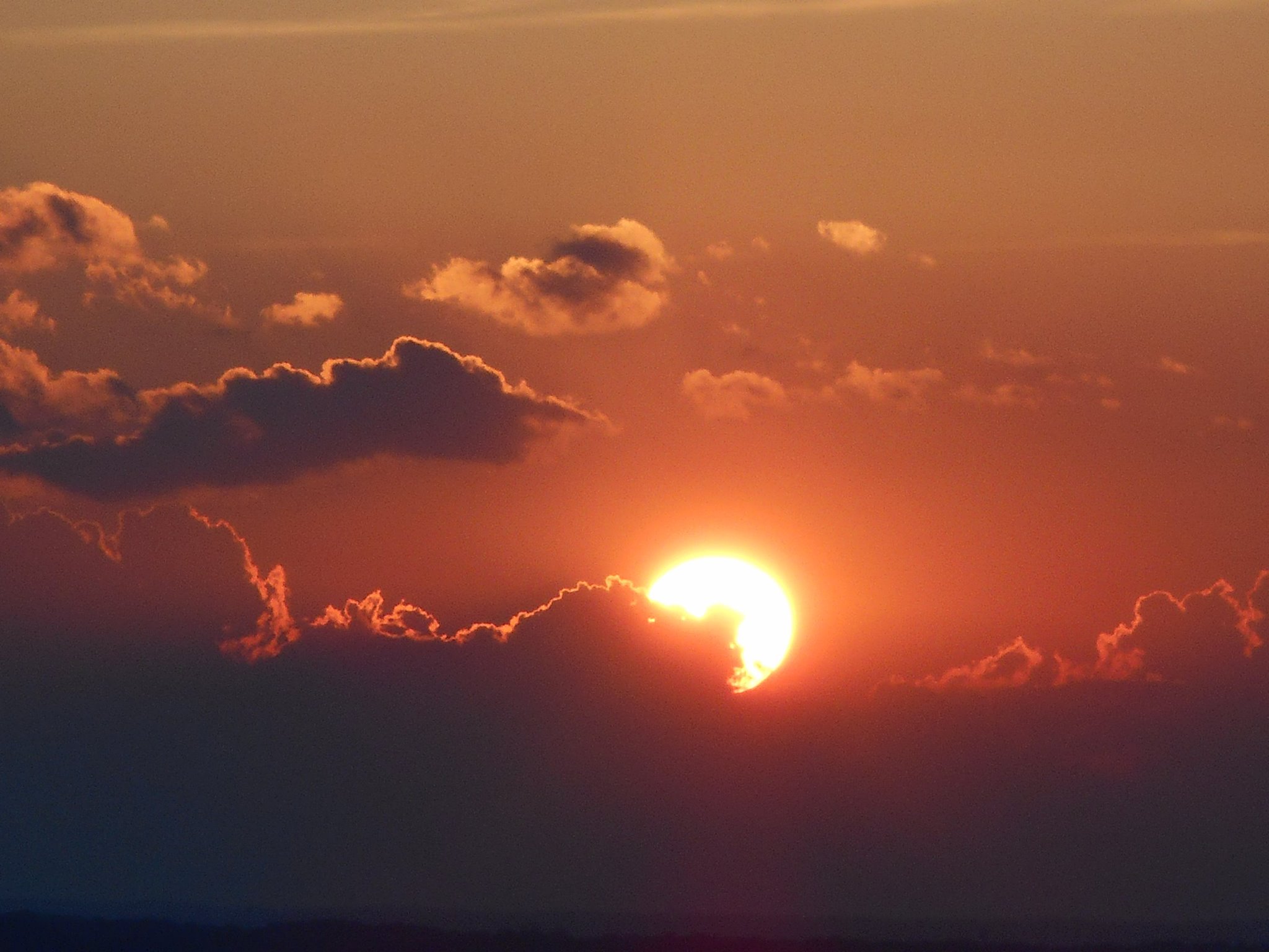 Sun setting in some clouds on west hill... from Hungerford Hill Rd.-east hill today 6-21-15.